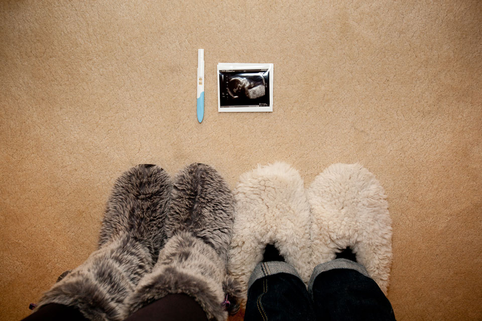 We’re having a baby! Our two sets of feet are soon to be joined by a third little pair.